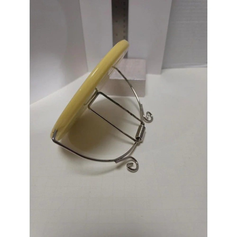 vintage celluloid travel mirror with metal attached stand